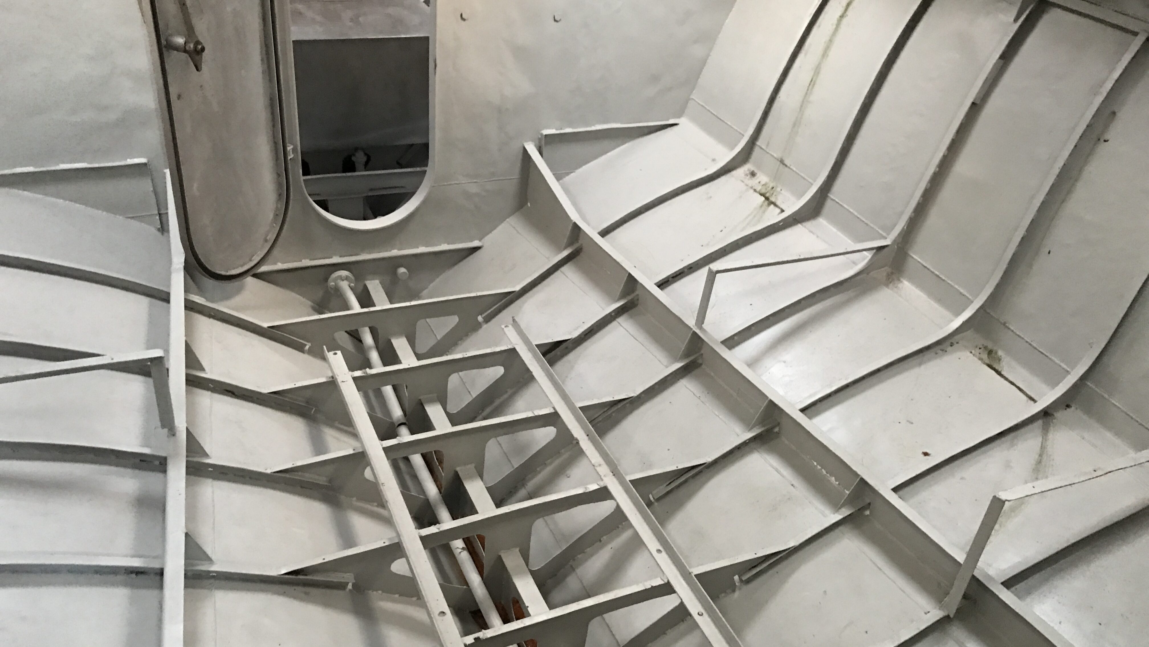 Stripped Hull During Vessel Conversion Interior of a stripped patrol vessel prepared for yacht conversion.